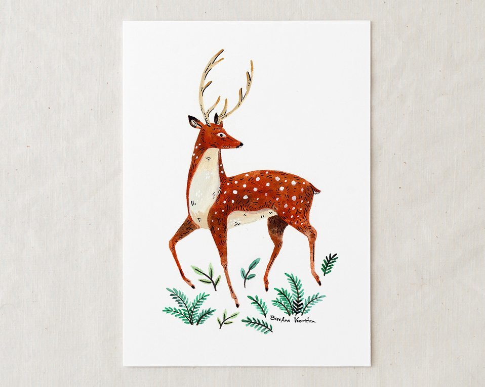 a 5x7 watercolor art painting of dainty spotted red deer with antlers looking over its shoulder with green foliage at its feet