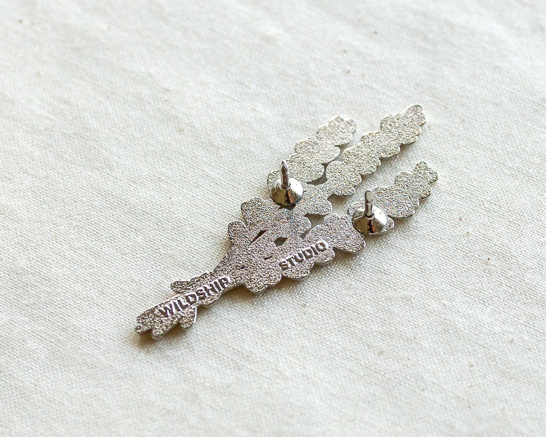 the backside of silver lavender enamel pin