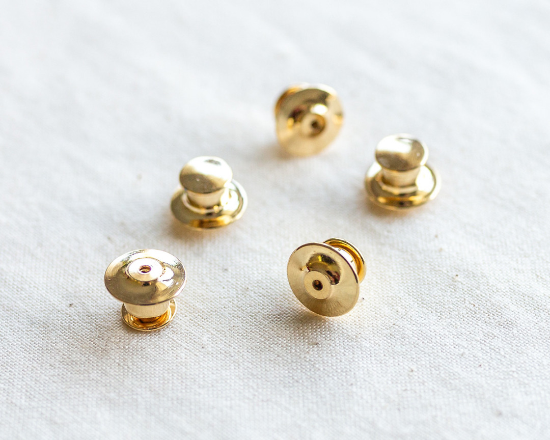 set of five deluxe gold locking pin backs