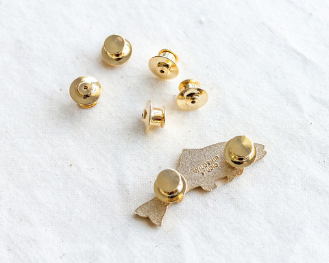 set of five deluxe gold locking pin backs