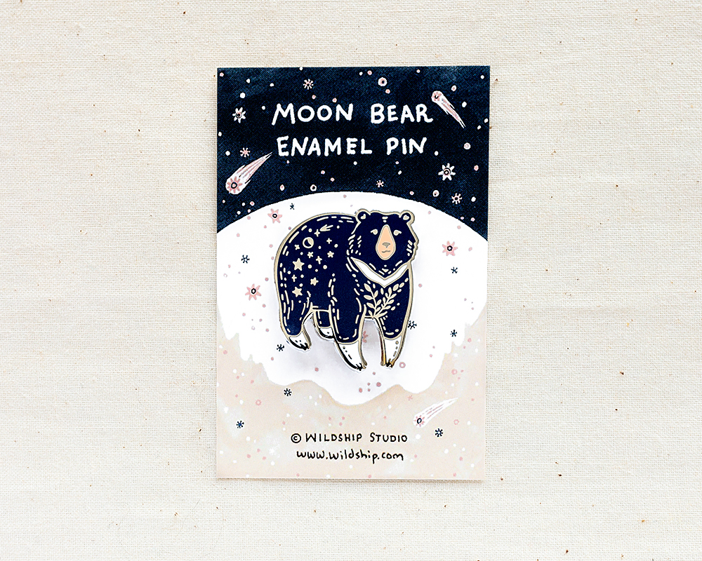 moon bear enamel pin in packaging by wildship studio