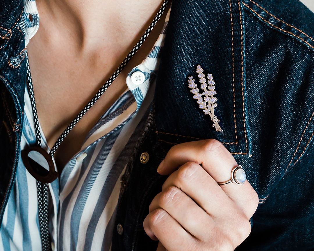 silver plant lavender lapel pin on denim jean jacket cuff